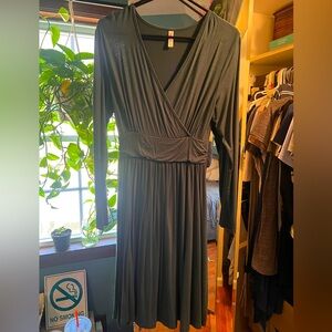 Dark green, long sleeve, silk-like dress.
